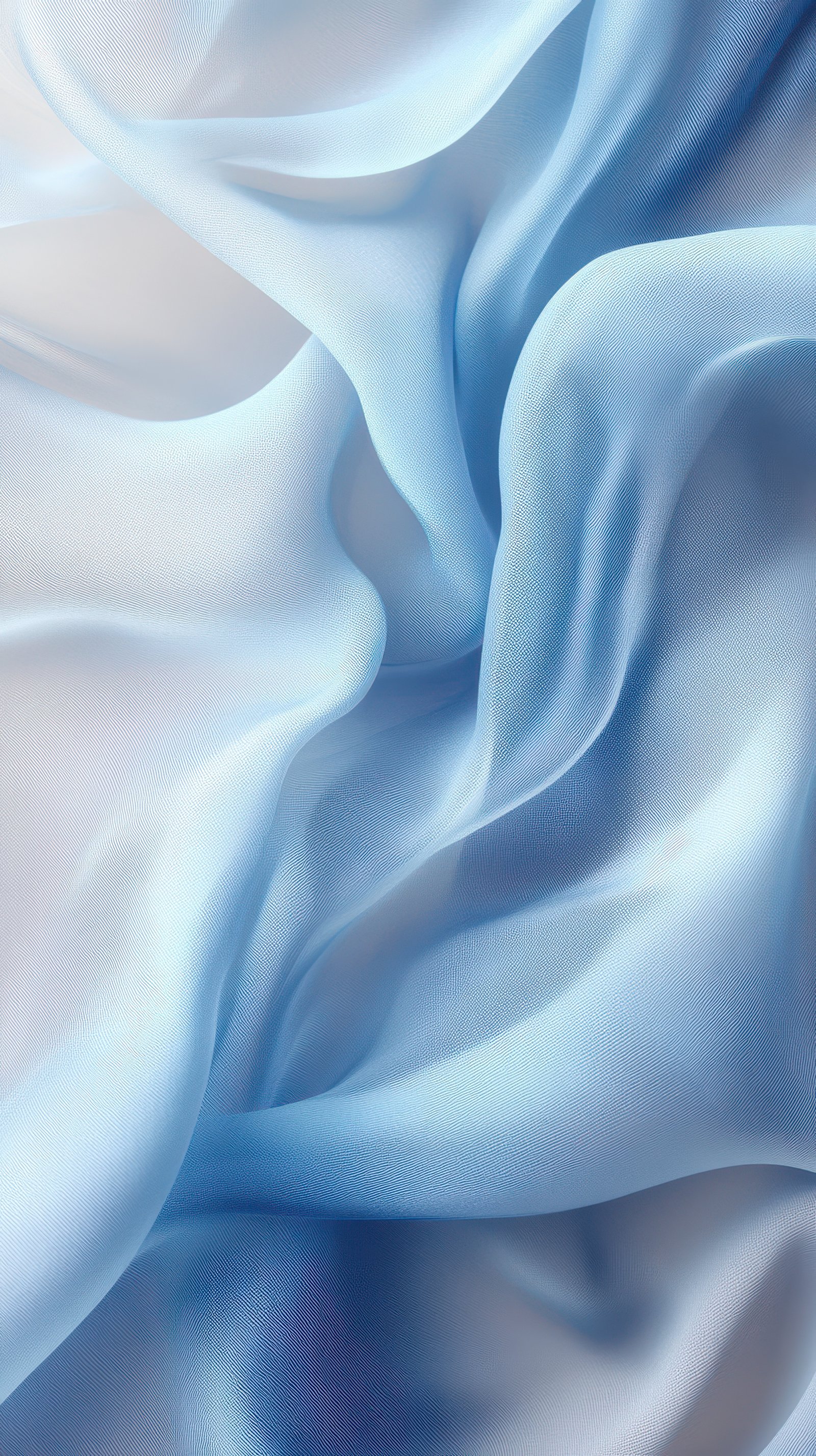 Soft blue fabric drapes creating elegant waves and curves illuminated by gentle light